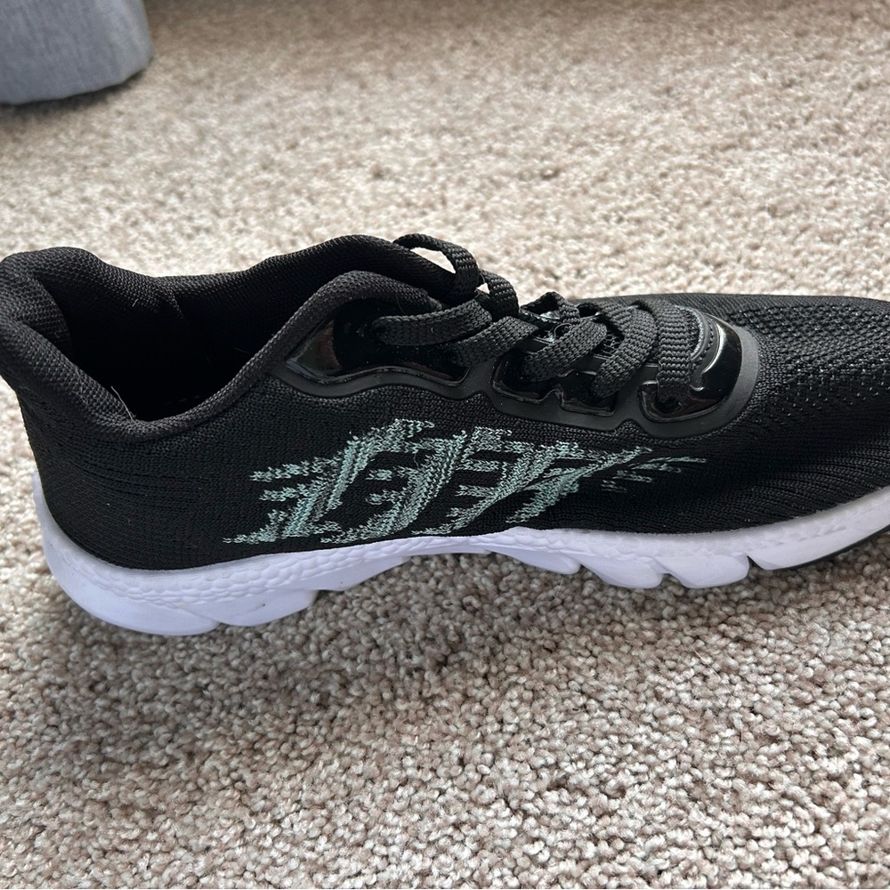 Stylish Black Sneakers with White Sole